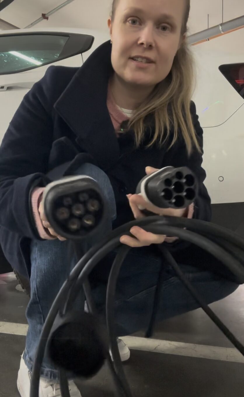 Nina Patkai holding EV charging cables