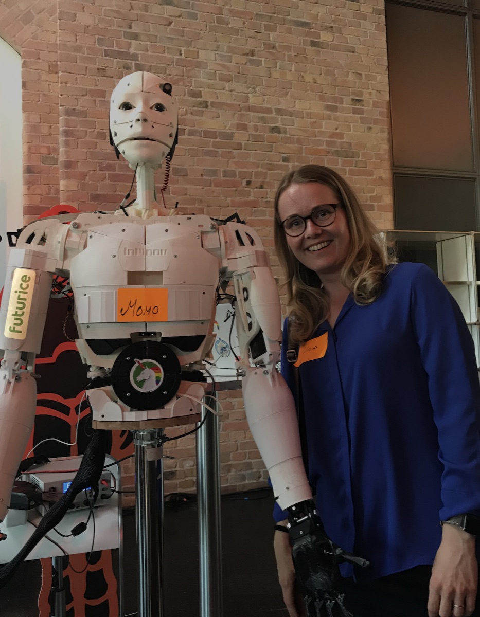 Nina Patkai with a robot at a Futurice event